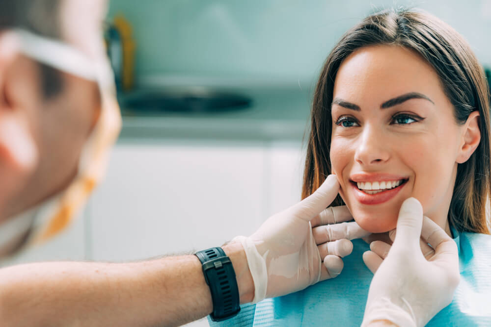 Woman being inspected by her dentist and choosing her Cosmetic Dentistry Treatment