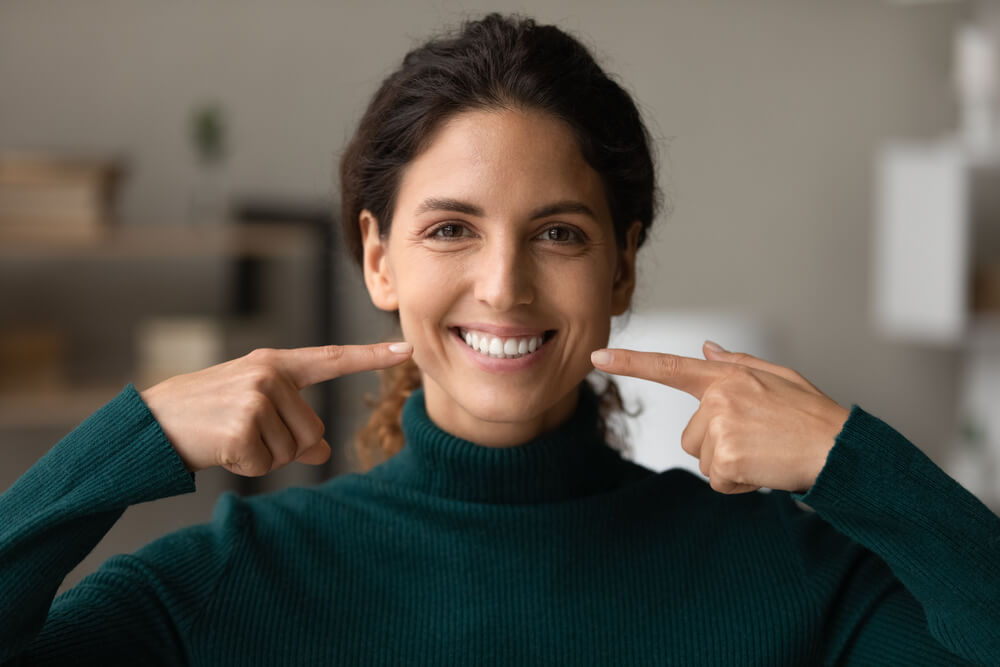 Woman in Austin, TX showing her white teeth