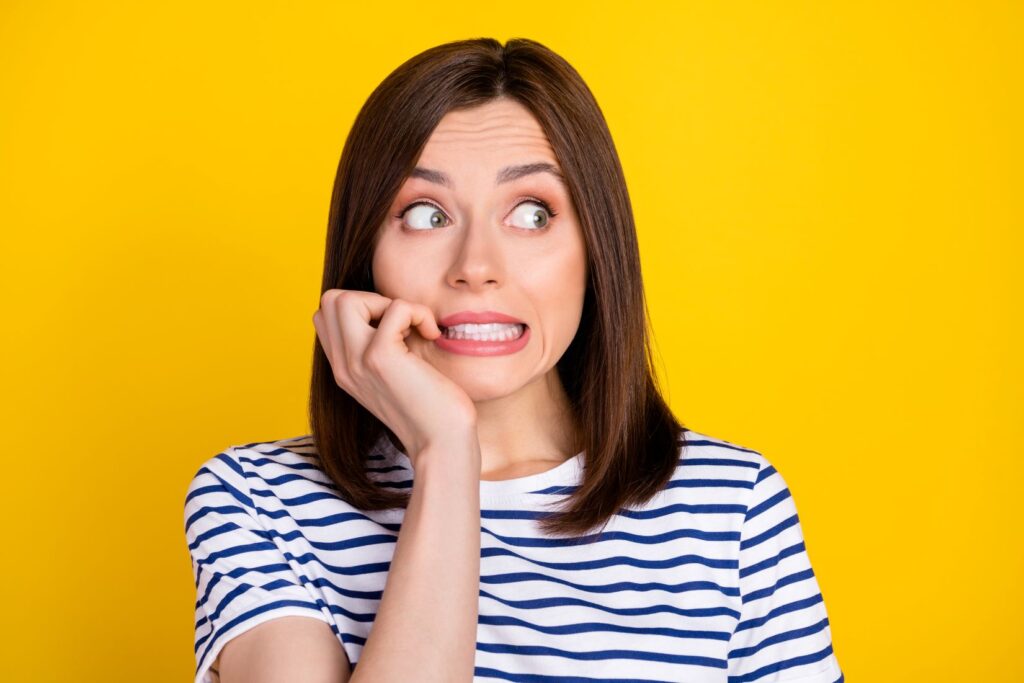 A woman having trouble deciding on dental treatment.